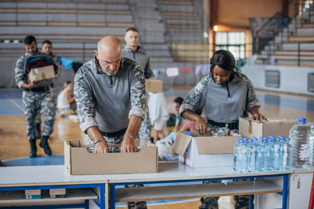 istock Soldiers preparing donations for civilians 1419559340