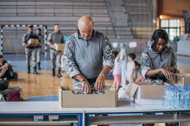 istock Soldiers preparing donations for civilians 1419559426