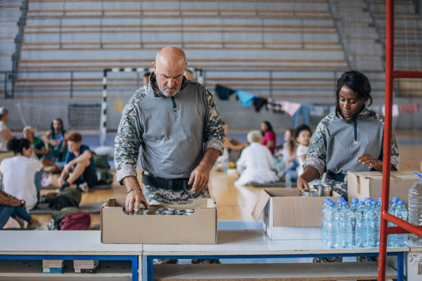 istock Soldiers preparing donations for civilians 1419559614