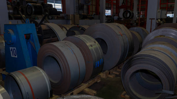 istock Rolls of galvanized steel sheet Scrap material stainless rolls Aluminium rolls inside the factory or warehouse. 1419559887