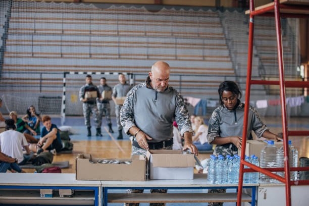 istock Soldiers preparing donations for civilians 1419560112