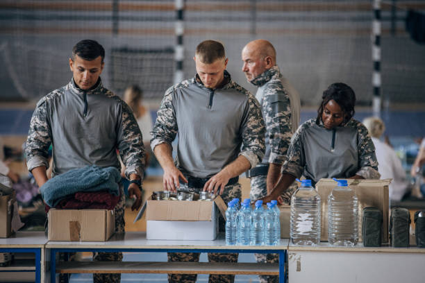 istock Soldiers preparing donations for civilians 1419561977