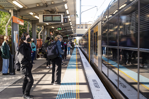 Sydney, Australia, August 31, 2022- Commuters boarding a train at Gordon train station, NSW