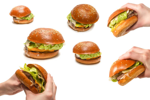 istock Hamburger in woman hands isolated on a white background. 1419563704