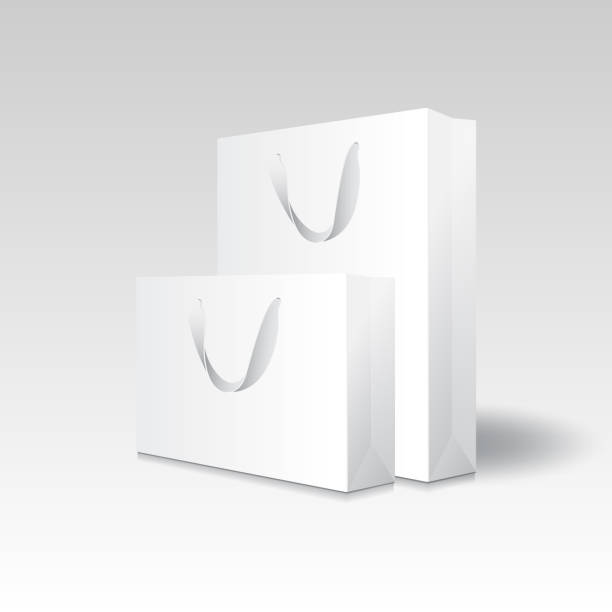 istock Blank white paper shopping bag or gift bag (2 sizes) with ribbon handles mockup template. 1419564687