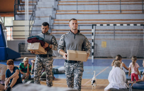 istock Soldiers carrying donations for civilians 1419568140