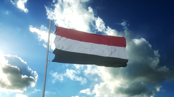 Bandera de Yemen ondeando al viento contra el hermoso cielo azul. Ilustración 3D photo