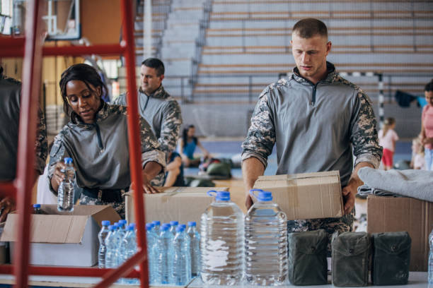 istock Soldiers preparing donations for civilians 1419570109