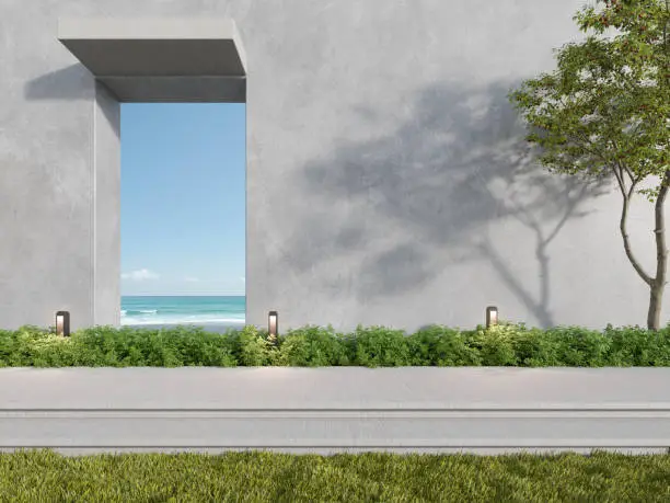 Photo of 3d rendering of concrete building with terrace and large window on sea background.