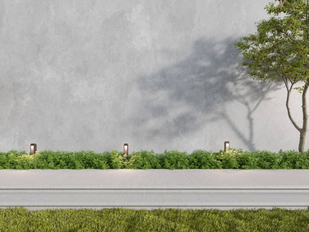 istock 3d rendering of large concrete building wall with garden. 1419570448