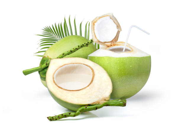 istock Young green coconut with coconut juice in half fruit and palm leaf isolated on white 1419572497
