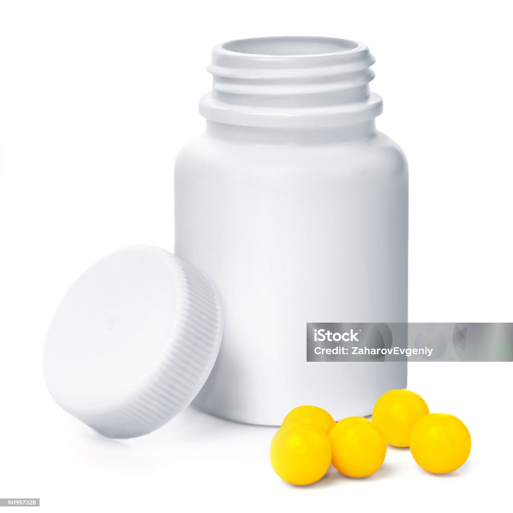 Aperto il contenitore di plastica giallo medica con vitamine - Foto stock royalty-free di Accudire