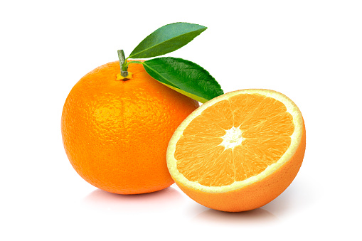 Orange fruit with green leaves and cut in half slice isolated on white background.