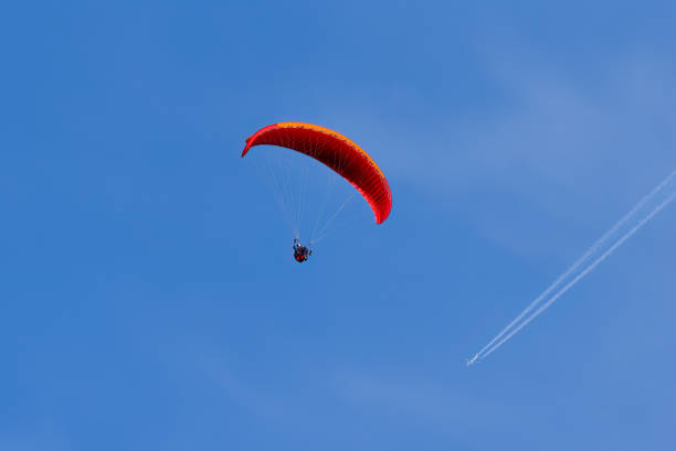 istock Paragliding in flight with airplane. 1419575841