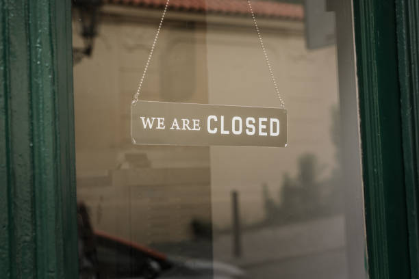 istock We are closed text on door entrance sign board. 1419576254