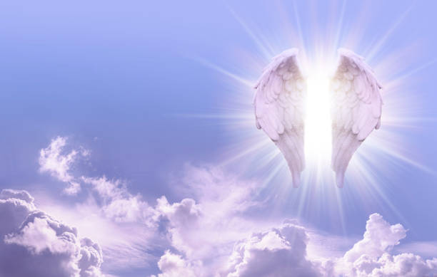 Guardian Angel Sky Message Banner Beautiful sunny blue sky with a pair of glowing Angel Wings on one side and copy space for angelic messages pics of guardian angels stock pictures, royalty-free photos & images