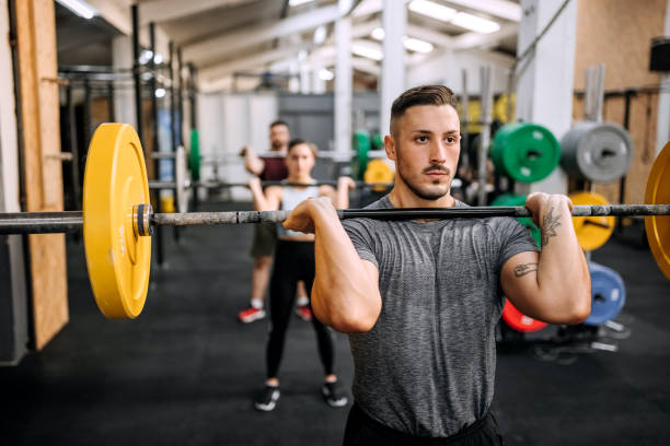 istock Muscular man lifting barbell 1419580457