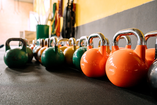 Kettlebells arranged on a floor with no people