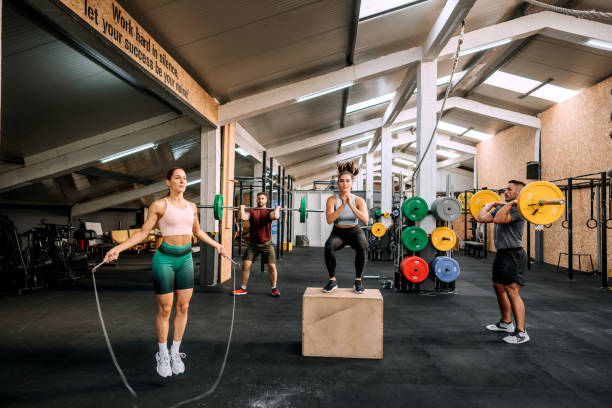 Group cross workout in a gym Group of athlete people working out in a gym circuit training stock pictures, royalty-free photos & images