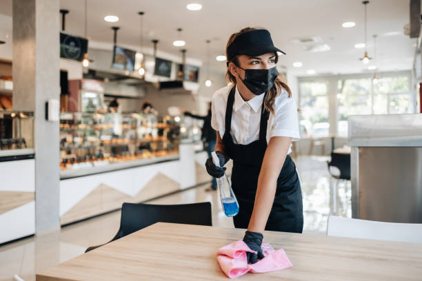 istock Young beautiful woman working in a bakery 1419583945