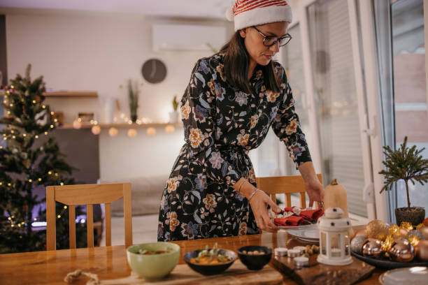 istock Women decorating Christmas table 1419584103