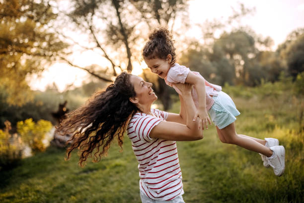 istock Mother and daughter having fun outdoors 1419584706