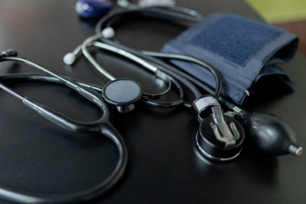 istock Closeup view to tonometer and stethoscope lying on the table. 1419585122