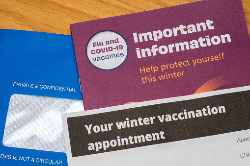 Mailing from NHS Scotland containing an invitation to attend an appointment for a winter flu and COVID-19 vaccination. The blue envelope contains a leaflet with important information about the vaccines and a letter giving a date, time and location for the appointment.