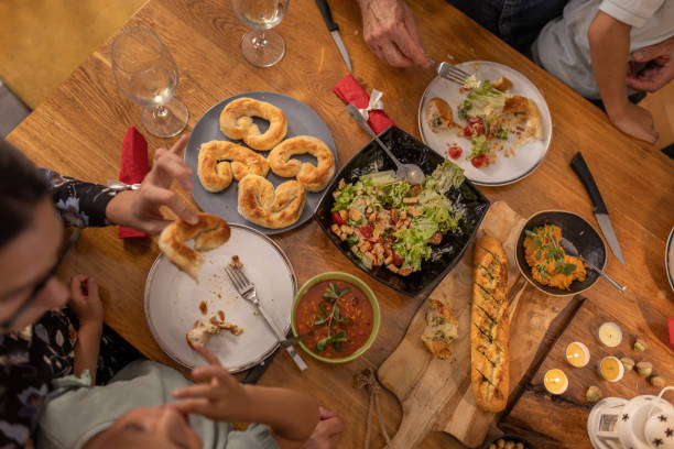 istock Family enjoying Christmas dinner together 1419586427
