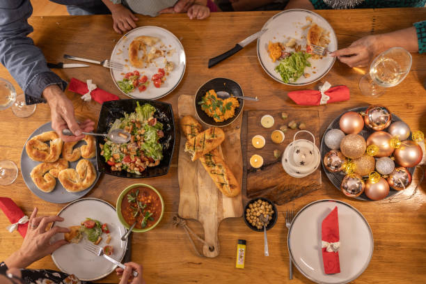 istock Family enjoying Christmas dinner together 1419586607