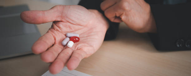 istock Unwell elder man taking a pills. 1419587192