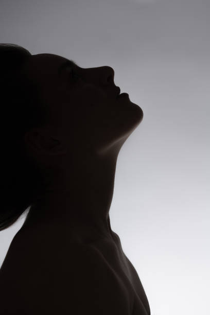 istock Woman black face silhouette with flying hairs 1419588340