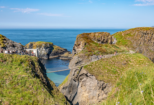 Crossing the Carrick-a-Rede rope bridge in County Antrim, Northern Ireland