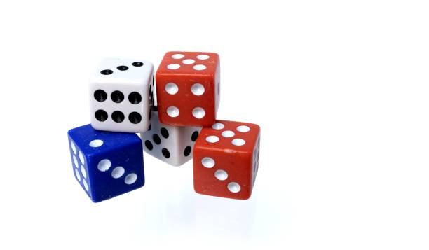 istock Red, white and blue colored dice isolated on white background 1419594682