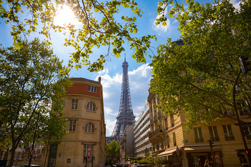 Eiffel Tower view from cozy street backlit
