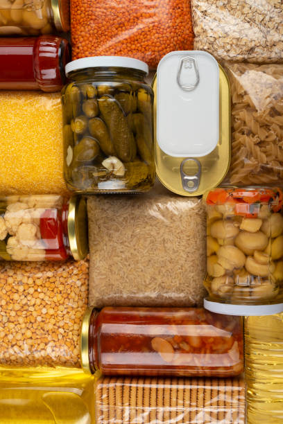 istock Emergency survival groceries on kitchen table closeup flat lay 1419599909