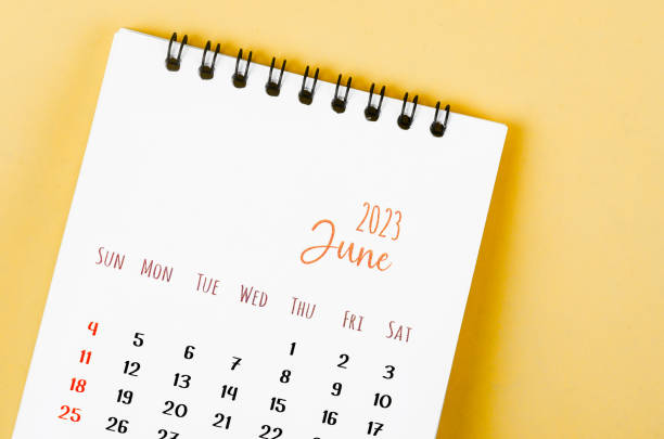 The June 2023 Monthly desk calendar for 2023 year on yellow background. stock photo