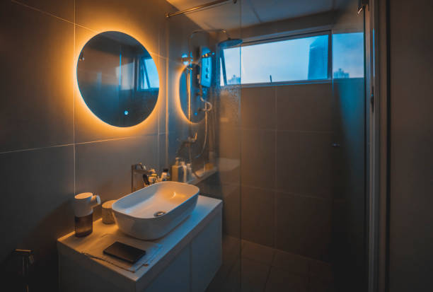 warm light cozy Interior of bathroom with mirror reflection and sink basin