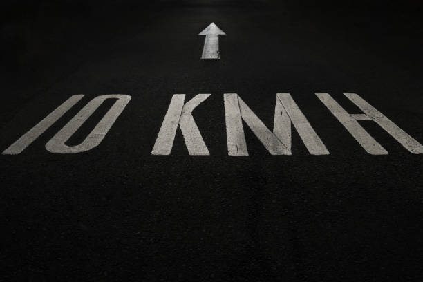 istock Road sign - low speed limit and direction arrow 1419601958