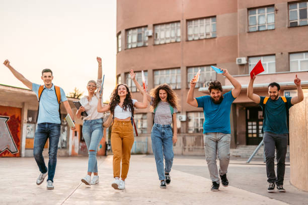 istock Group of Students Celebrating Passing The Exams On The University Campus 1419603091