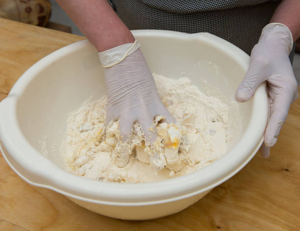 istock Chef confectioner prepares dough for making pie sweets hands working moment 1419604532