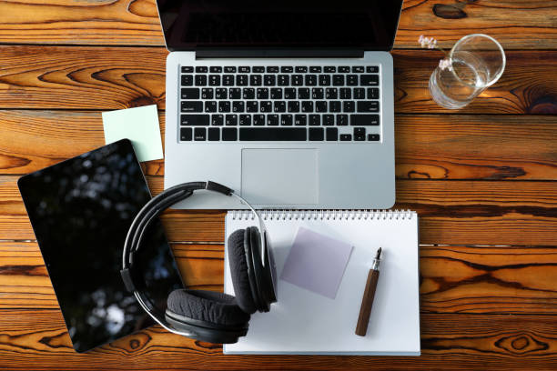 istock laptop and headphones on the table 1419604541