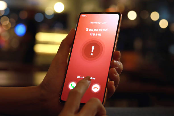 istock Person receiving suspected spam call on smartphone from an unknown caller 1419606845