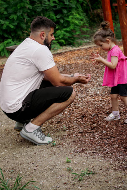 istock The daughter enjoys playing with her father outside 1419608359