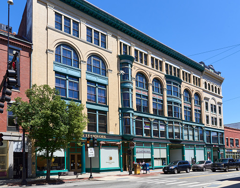 Lowell, MA USA - August 1, 2022: Lowell's historic Bon Marche dry goods store on Merrimack St was built in sections from 1874 to 1927 as the business grew. It was in the heart of the old Lowell commercial district.