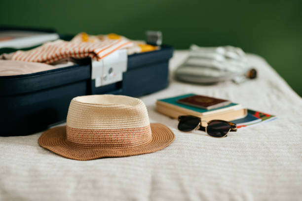 istock Close Up Shot of an Open Suitcase With Stuff Ready for a Summer Vacation 1419610174