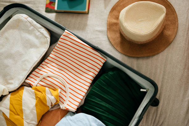 Close Up Shot of an Open Suitcase With Stuff Ready for a Summer Vacation