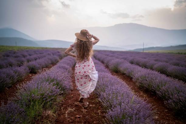 istock Young woman at a lavender field 1419612342