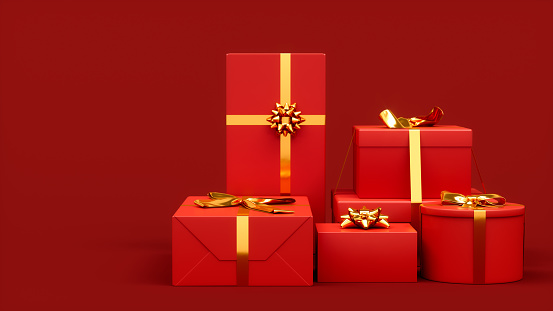 Gift boxes on red background with copy space.