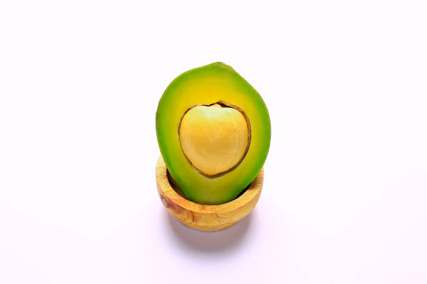 half sliced ​​avocado isolated on white background